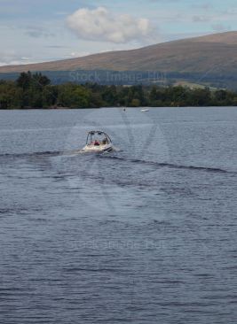 Couple enjoying a day on loch lomond in their powerboat image