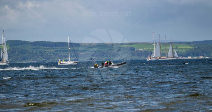 Yachts and boats enjoying a particularly choppy summer day at sea