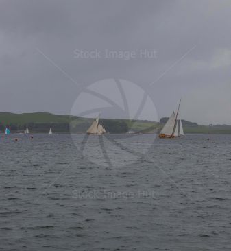 Teams racing yachts in regatta on a very blustery day