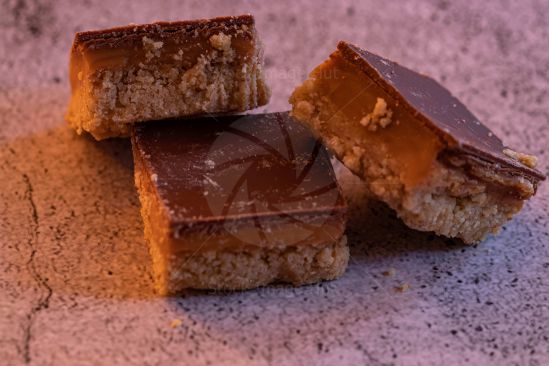 Delicious caramel shortcake biscuit cut into three mouth-watering chunks