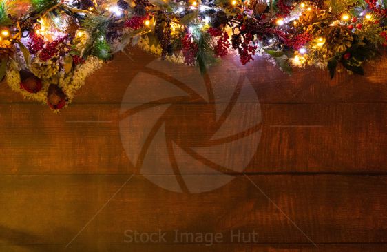 Christmas decorations and lights sitting on a wooden board