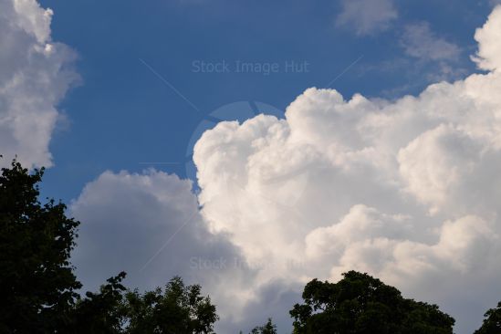 Clouds starting to gather on a sunny day showing change is coming