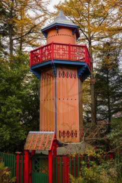 Colourful wooden watch tower within woodlands