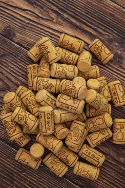 A Collection of new wine corks sitting on wooden background