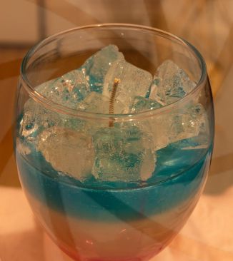 Real wax candle in form of a drink with wax ice cubes image