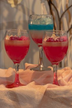 Three candles in the shape of cocktail drinks with wax ice cubes