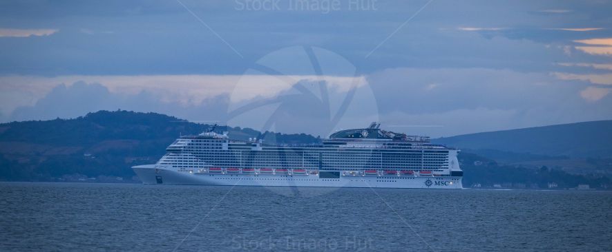 Massive cruise ship MSC Virtuosa leaving port of Greenock and heading out to sea