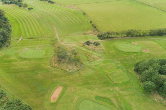 Looking down on section of a golf course from a drone