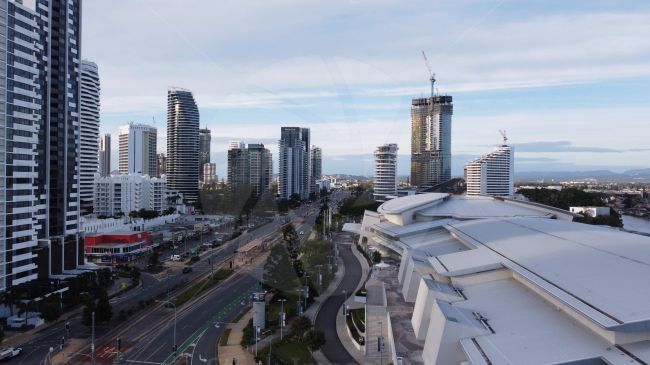 Part of the Queensland skyline, buildings and busy road  shot from a drone