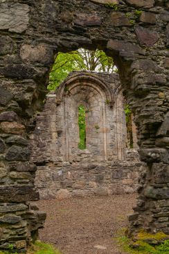 Looking through an archway into the immpresive Dunstaffnage Castle Chapel