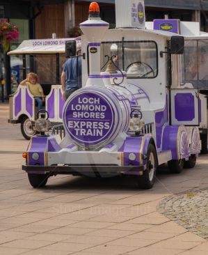 Sightseeing tour aboard the Lomond shores express train at loch Lomond image