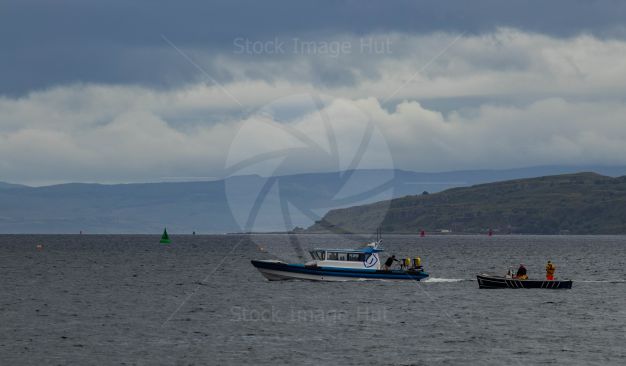 A few small boats returning back to harbour after ferrying crew out to yachts at the Fife regatta