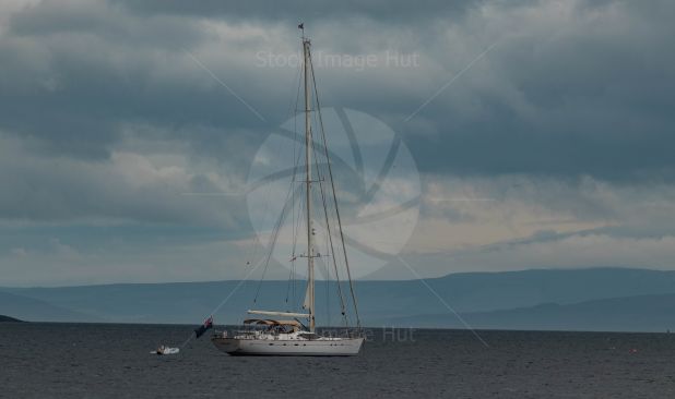 Beautiful yacht getting ready to head out to sea on a calm day image
