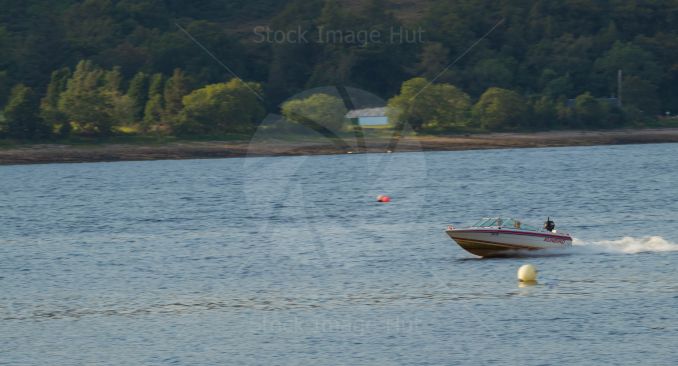 Speedboat cruising over sea at Fort William, Scotland