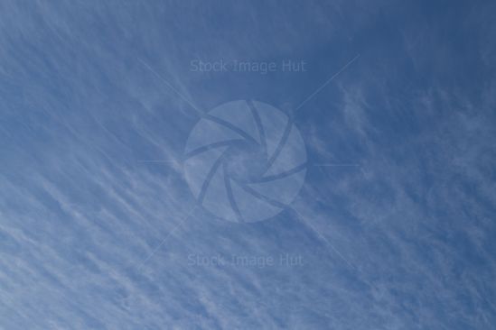 Clouds streaking across summer sky image