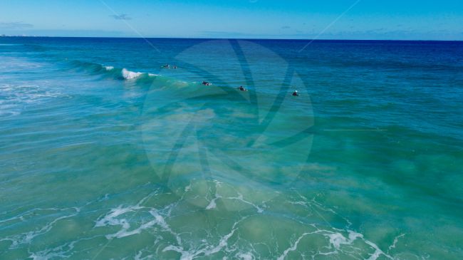 Surfers at Scaraborough beach enjoying the waves on a lovely day, WA image
