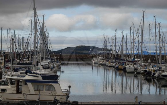 Yachts and boats moored in harbour